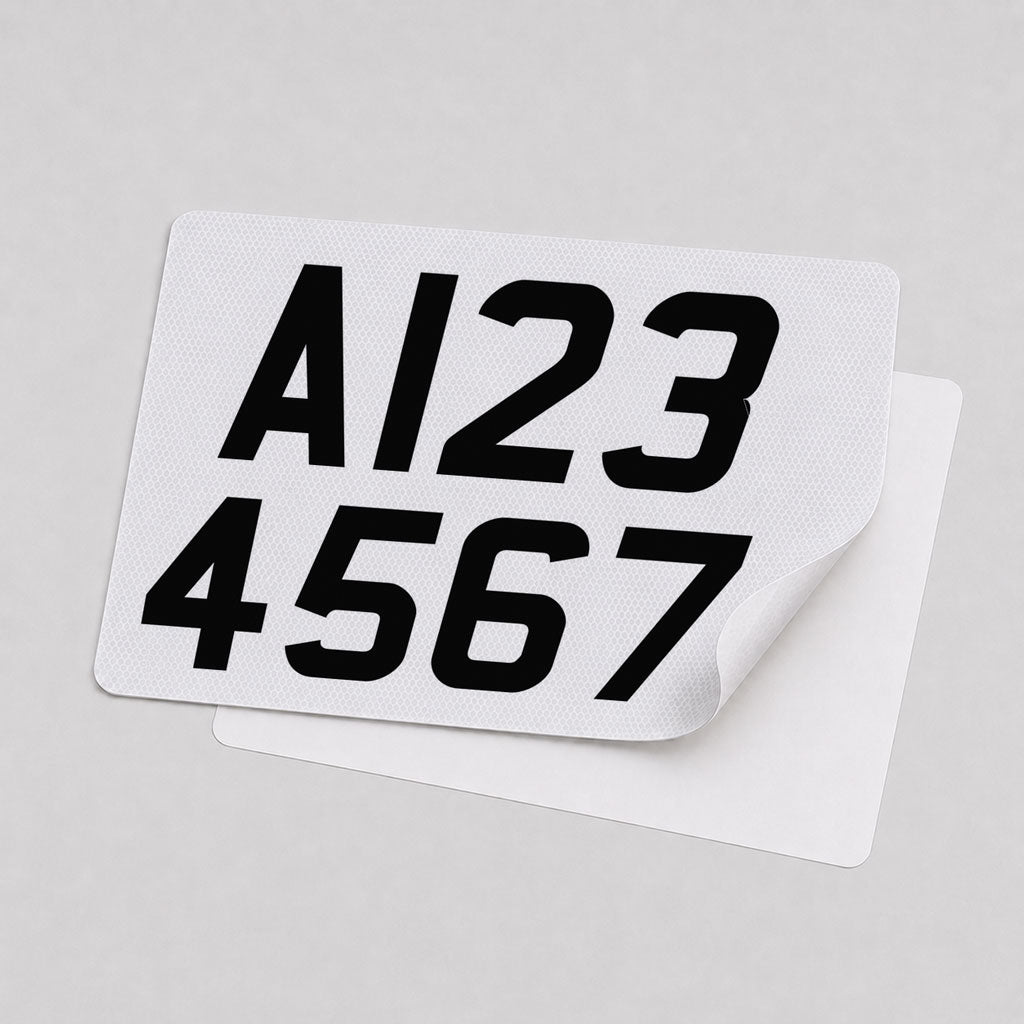 White reflective two-line trailer registration plate with A123 over 4567